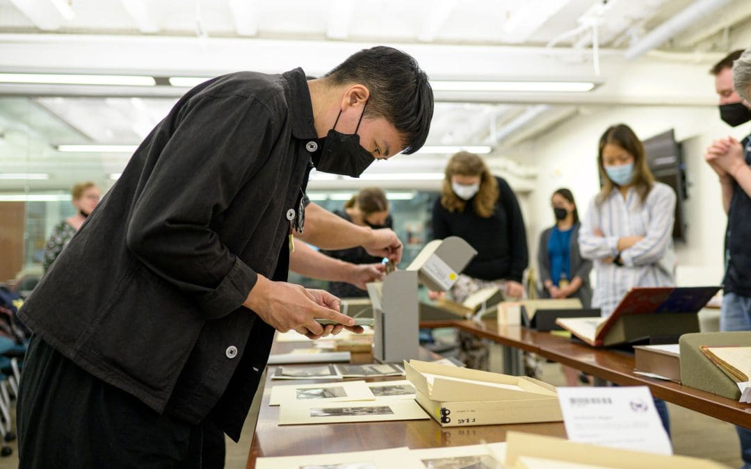 A person looking at archival materials.