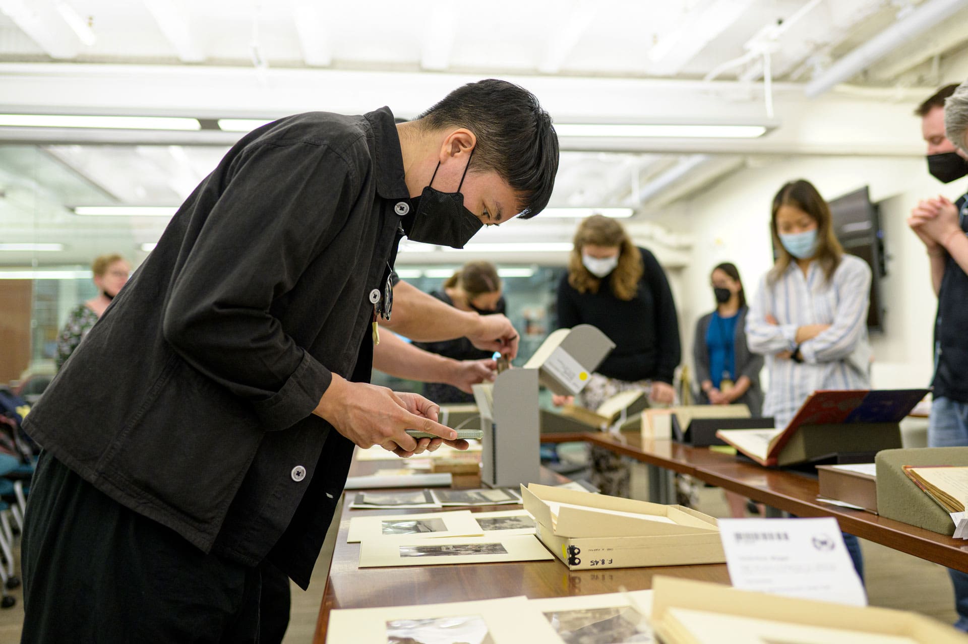 A person looking at archival materials.