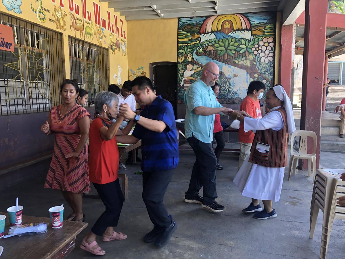 A group of people dancing.