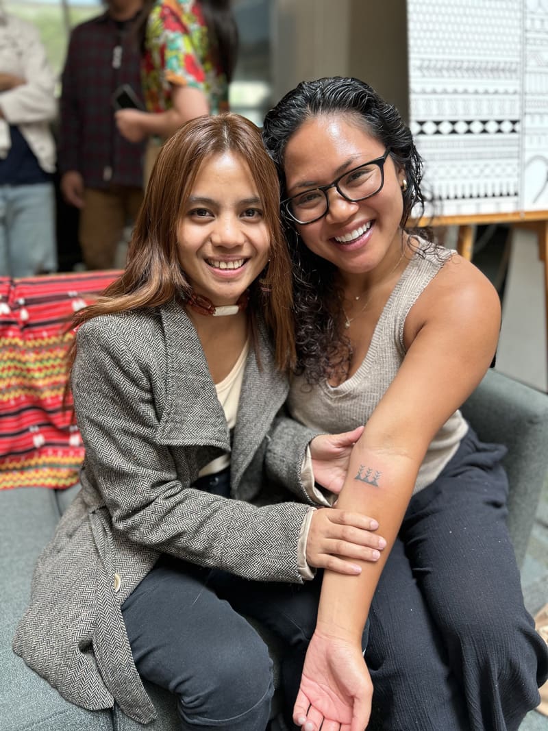 Two women smiling.